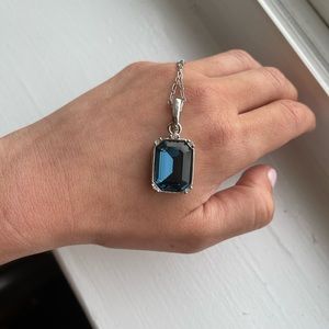 Touchstone Swarovski crystal necklace with blue pendant